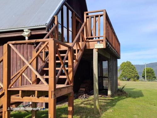 a large wooden staircase leading up to a building at Mt Elephant Bush Retreat - Gray in Gray