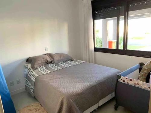 Ένα ή περισσότερα κρεβάτια σε δωμάτιο στο Verão Perfeito no Condomínio Malibu!