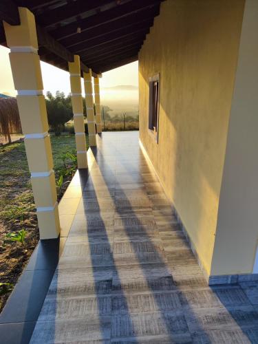 a hallway of a house with a view of the horizon at Machalele's House - Casa T2 acolhedora para casais e famílias na Ilha de Inhaca in Portinho da Inhaca