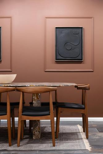 a dining room with a table and a tv at Impressive 5Beds House in South Kensington in London