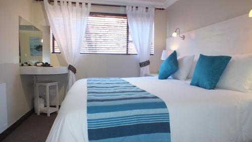 Cama o camas de una habitación en White Shark Guest House