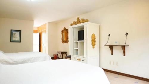 Postel nebo postele na pokoji v ubytování Hotel Ex Hacienda La Pitaya Querétaro