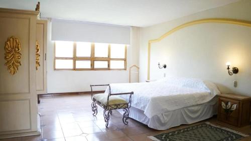 Postel nebo postele na pokoji v ubytování Hotel Ex Hacienda La Pitaya Querétaro