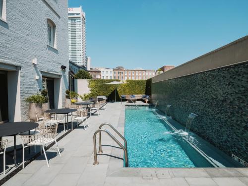 a swimming pool on the roof of a building at ONE11 Hotel in New Orleans