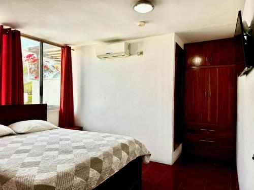 Postel nebo postele na pokoji v ubytování Hostal Muyuyo