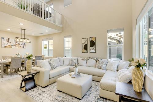 a living room with a white couch and a table at Mtn-View Gem with Private Yard Luxe Beaumont Home in Beaumont