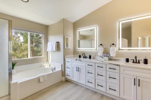 a bathroom with two sinks and a tub and a shower at Mtn-View Gem with Private Yard Luxe Beaumont Home in Beaumont