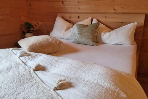 two beds with pillows on them in a room at Ökologisches Hideaway mit Sauna und großem Garten in Seßlach