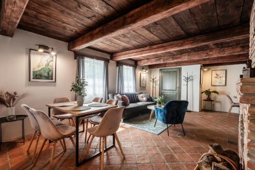 a living room with a table and chairs at Chata Alpina Horní Mísečky in Horni Misecky