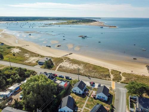 an aerial view of a beach with boats in the water at Across from Mayo Beach walk to downtown in Wellfleet