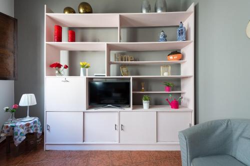 a white entertainment center with a tv in a living room at Balcony Spacious 2BR Arucas Historic Center in Arucas
