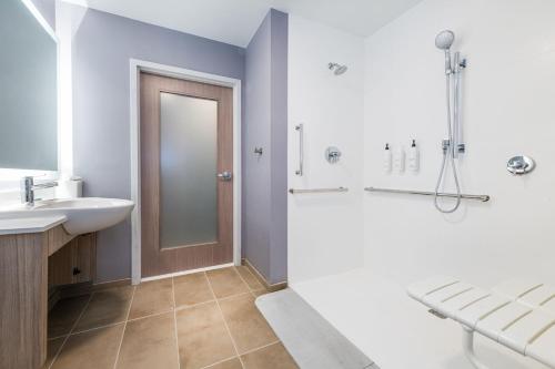 a bathroom with a sink and a shower at SpringHill Suites by Marriott Baltimore Downtown Convention Center Area in Baltimore