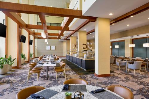 a large dining room with tables and chairs at The Westin Atlanta Airport in Atlanta