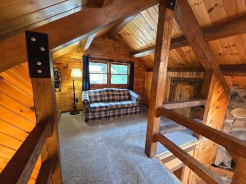 an overhead view of a living room in a log cabin at Private and Cozy Cabin Close to Williamsport, PA in Linden