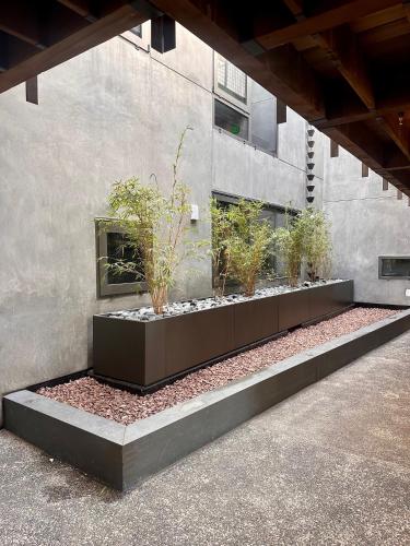 Jardin de l'établissement City24 Condo Hotel Little Italy Mission Hills