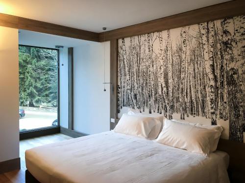 Postel nebo postele na pokoji v ubytování NH Collection Alagna Mirtillo Rosso