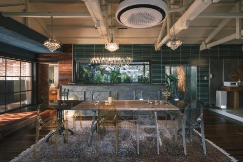 a dining room with a table and chairs at Ocean View Riad Jeju in Jeju