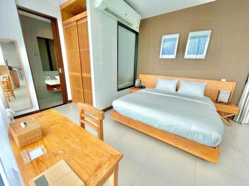 Ένα ή περισσότερα κρεβάτια σε δωμάτιο στο Zensala Riverpark Resort-SHA Extra Plus