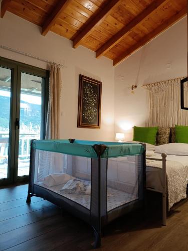 a large fish tank in a room with a bed at Elaia Rest House Retreat in nature in Fréngaina