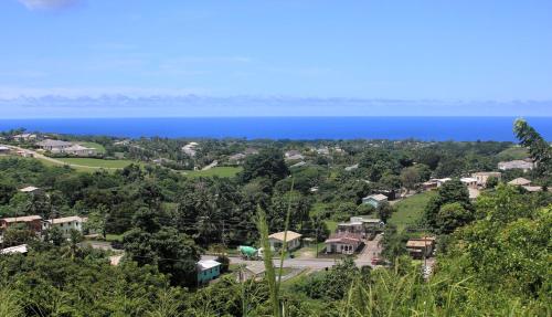 an aerial view of a town with the ocean in the background at Breezy Vista on the Terrace - West Coast, Saint James, Barbados in Saint James