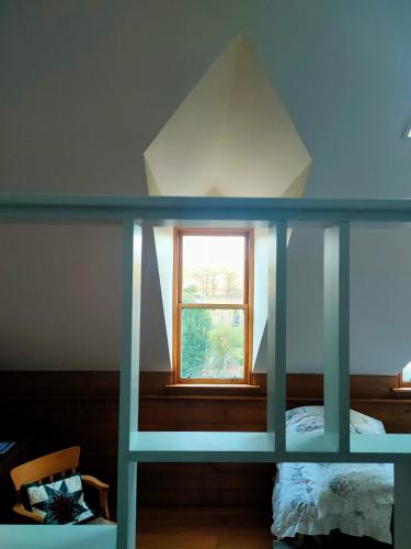 Una cama o camas en una habitación de Burnside Homestead