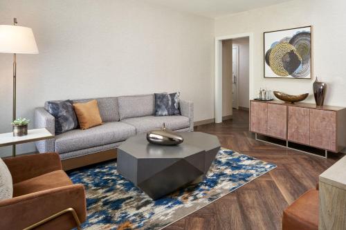 a living room with a couch and a table at The Westin Indianapolis in Indianapolis