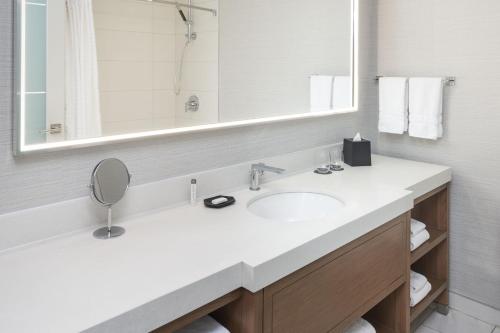 a bathroom with a sink and a mirror at The Westin Indianapolis in Indianapolis