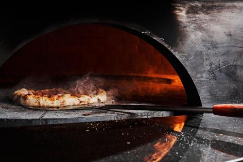 a pizza is being cooked in an oven at The Westin Indianapolis in Indianapolis