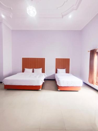 Postel nebo postele na pokoji v ubytování D'Rey Hotel