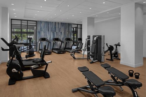 a gym with several treadmills and exercise bikes at Renaissance Columbus Westerville-Polaris Hotel in Westerville