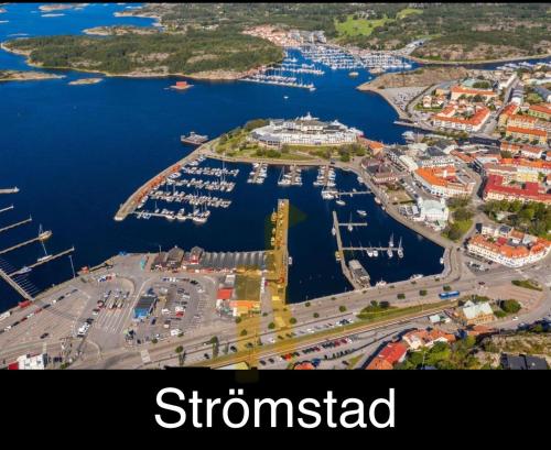 an aerial view of a harbor with boats in the water at Green Forest Oasis & Sea in Strömstad
