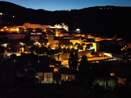 a view of a city at night with lights at Hotel Villa Stella in Cascia