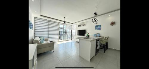 a kitchen and living room with a couch and a table at the best place in Karavas