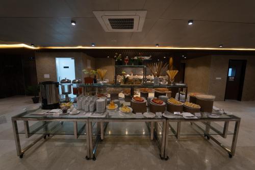 a table with cupcakes on it in a room at Paragon Hotel & Resort in Sreemangal