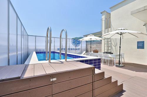 a swimming pool on the roof of a building at Daegu February Hotel Lions Park in Daegu