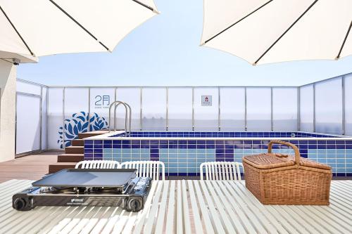 a rendering of a kitchen with a grill and a pool at Daegu February Hotel Lions Park in Daegu