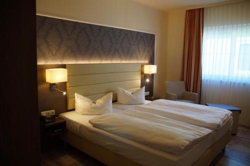 Postel nebo postele na pokoji v ubytování Hotel An der Hasenheide