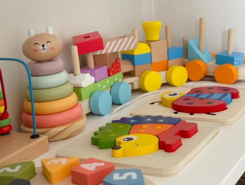 a toy room with a bunch of wooden toys at Ferienwohnung Hintermoos in Kißlegg
