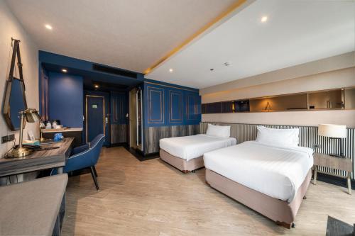 Katil atau katil-katil dalam bilik di Vince Hotel Pratunam