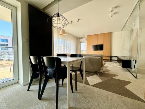 Télévision ou salle de divertissement dans l'établissement Fred&Moris Apartments