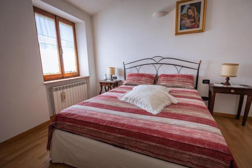 Postel nebo postele na pokoji v ubytování Santa Fiora Ospitalità Diffusa - La Vecchia Officina