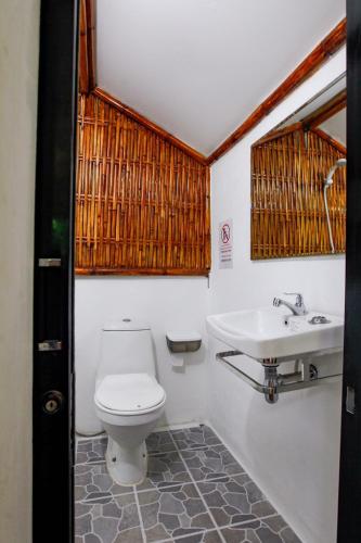 a bathroom with a toilet and a sink at Salisa Resort in Ko Lipe