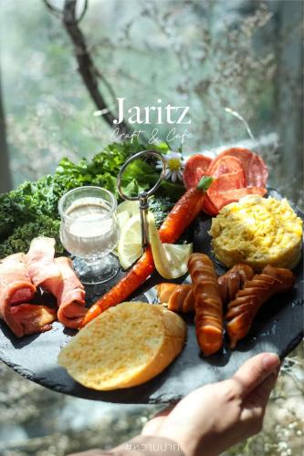 a tray of food with sausage and other foods at Style Jaritz in Ban Bang Phai