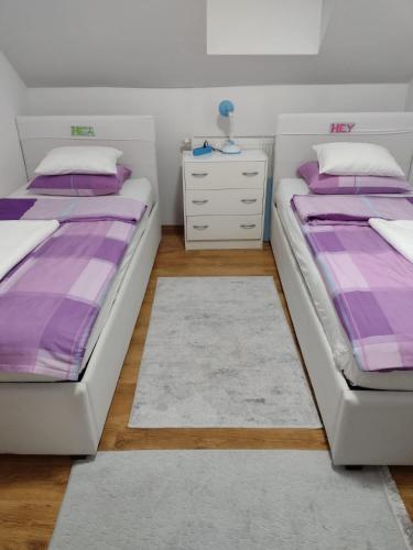 Postel nebo postele na pokoji v ubytování Apartman Breza