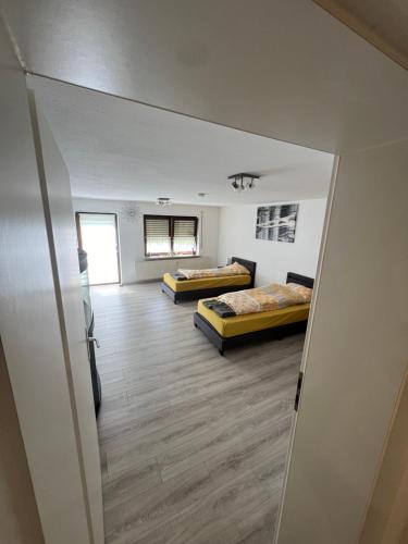 a view of a room with two beds in it at Herrenalber in Bad Herrenalb