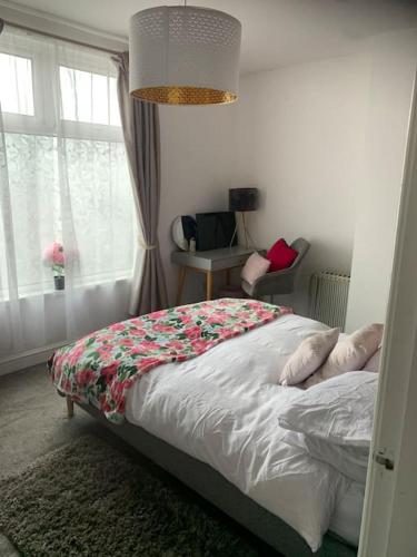 a bedroom with a bed and a window at 2 bedroom apartment in Horwich