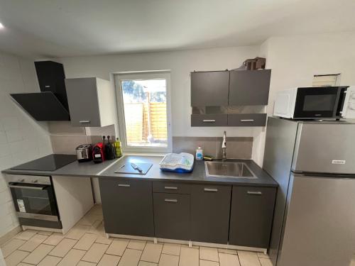 Η κουζίνα ή μικρή κουζίνα στο Studio avec terrasse