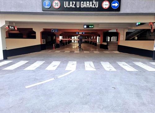 an empty parking lot in a shopping mall at Apartman1105 Sarajevo Free Garage in Sarajevo