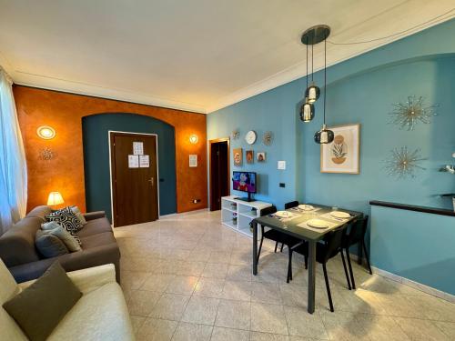 a living room with a couch and a table at B&B La Borasca - Apartments in Casalpusterlengo