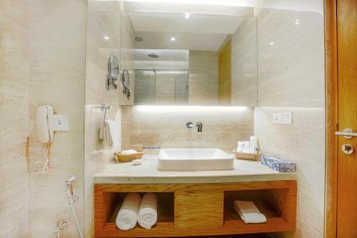 a bathroom with a sink and a mirror at Best Western Plus Chandigarh Mohali in Mohali